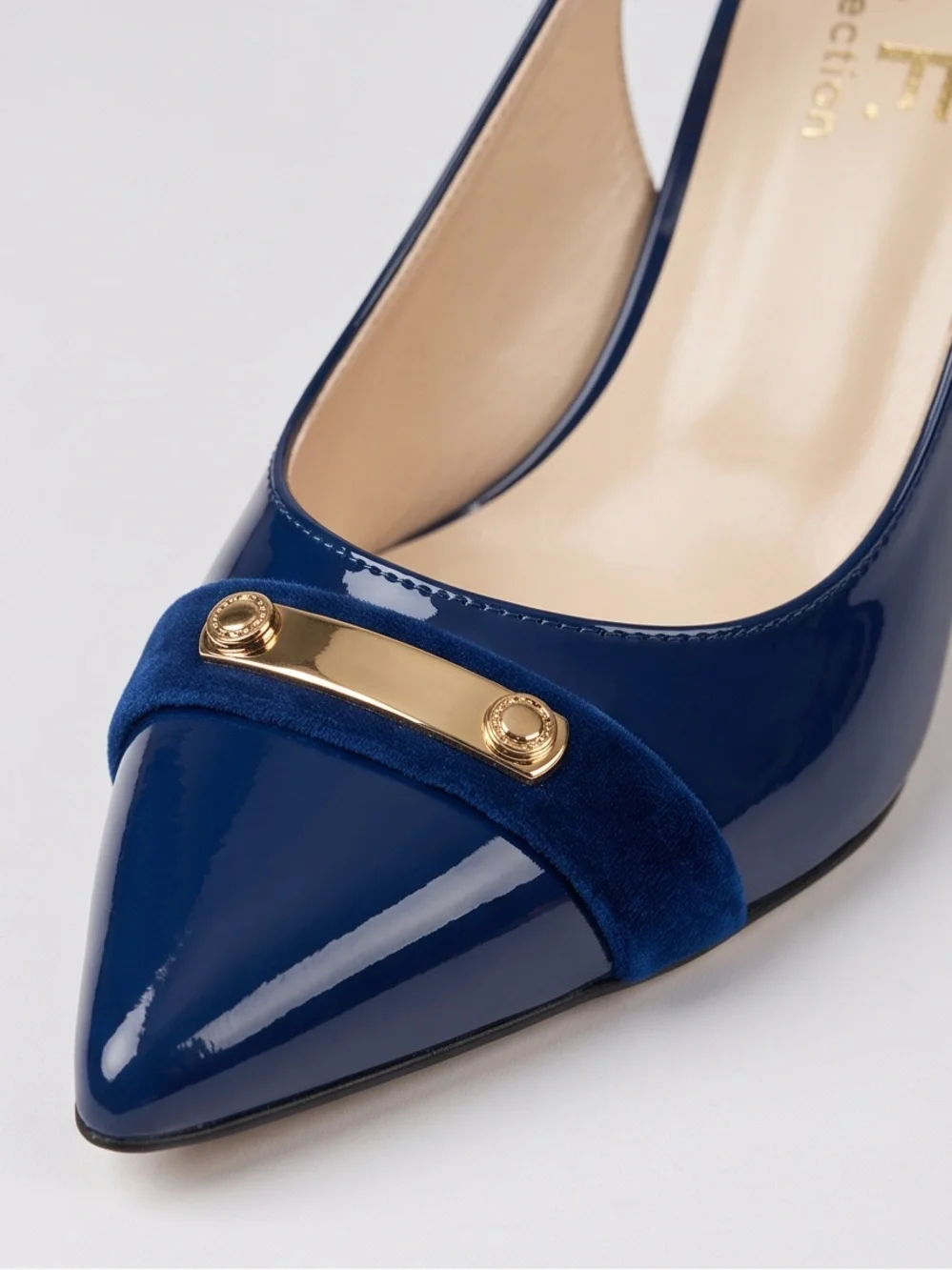 M. F. Collection Women’sNavy Patent Pointed-Toe Slingback Heels with Gold Accent